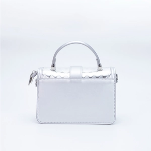 Minimalist silver PU leather handbag for women featuring a stylish metallic finish