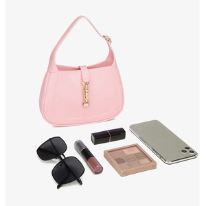 Pink PVC crescent hobo bag with gold buckle showing daily storage capacity for essentials