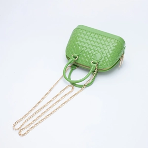 Neon green woven PVC crossbody bag with golden chain strap and top handles