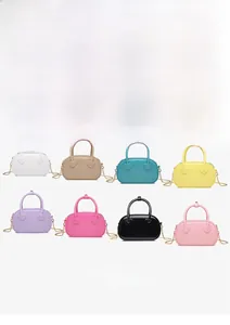 Detail view of heart-shaped handle connectors on trendy mini PVC jelly crossbody bags