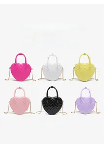 Collection of six colorful heart-shaped quilted handbags with metal chain straps