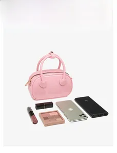 Pink PVC jelly bag showing spacious storage for makeup and accessories in a flat lay view