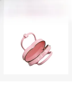 Internal view of a pink heart-shaped PVC bag showing its compact storage capacity