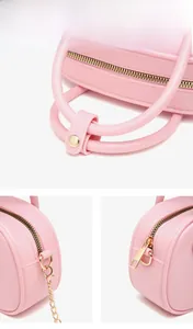 Detailed close-up of pink PVC jelly bag showing gold metal hardware and zipper