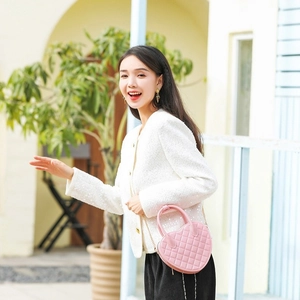 Pink heart-shaped PVC jelly bag with quilted pattern and gold chain strap for women