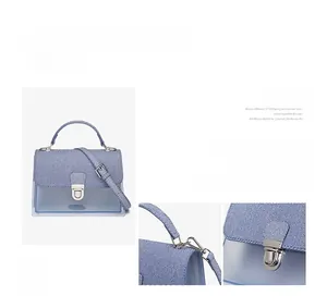Light blue crossbody jelly bag with denim texture flap and metallic push-lock detail