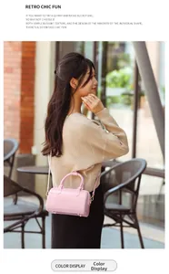 Pink PVC jelly cylinder bag with glossy finish and metal D-rings shown in street style