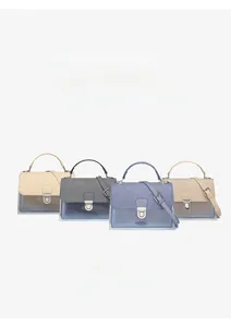 Detail view of multi-color PU leather and transparent crossbody envelope bags with metal buckles