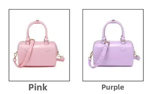Mini PVC jelly Boston bags in pink and purple colors with adjustable shoulder straps