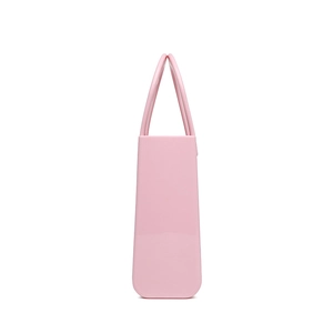 Pink waterproof PVC beach bag with dual handles shown from a minimalist side profile view