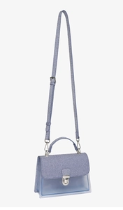 Detail of blue striped crossbody jelly bag with translucent PVC and silver metal lock