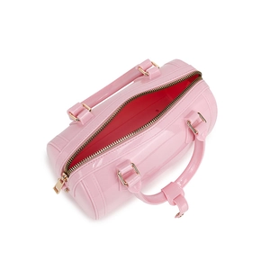 Pink PVC jelly mini barrel bag with golden metal zipper on a clean white background