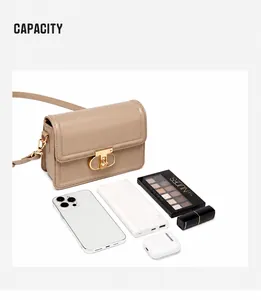 Flat lay of khaki PU leather crossbody bag showing internal capacity with daily essentials