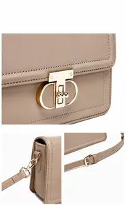 Macro detail of khaki PU leather bag showing gold hardware buckle and precise stitching