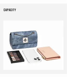 Detail view of denim quilted crossbody bag showing storage capacity for phone and makeup
