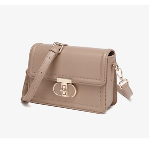 Detail view of khaki PU leather crossbody bag featuring a golden T-shaped metal lock