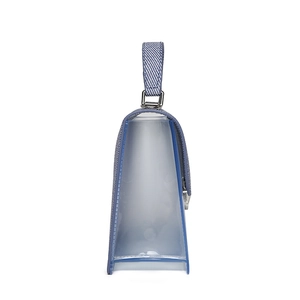 Blue denim and PVC jelly handbag featuring a trapezoid shape and silver metal hardware