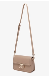 Detail of khaki PU leather mini square bag featuring gold lock and adjustable strap
