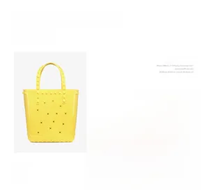 Detail view of yellow PVC beach tote bag with star cutouts and square rivet textures