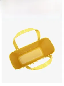 Top view of bright yellow hollow beach bag showing spacious interior and textured handles