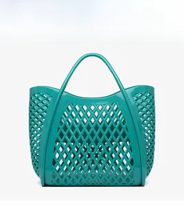 Detailed front view of hollow diamond pattern PVC beach basket in Tiffany blue color