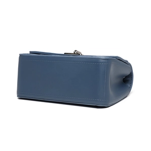 Blue denim quilted crossbody bag with precise stitching and metal clasp detail
