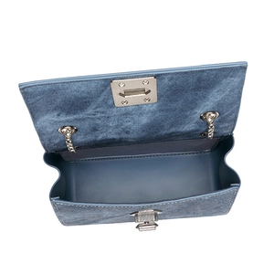 Deep blue denim rhombic crossbody bag with silver chain strap and metal lock closure