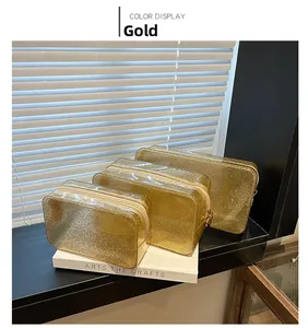 Three sizes of semi-transparent gold glitter makeup bags with durable gold zippers