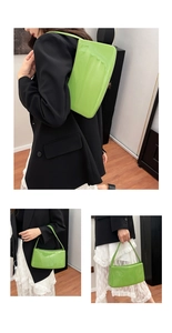 Detalle del bolso de hombro verde brillante en cuero sintético con acabado moderno