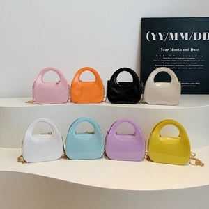 Mini glossy patent leather clutches in multiple colors with metallic chain straps