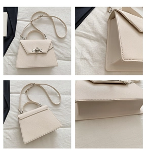 Détails de la texture Saffiano et boucle argentée de ce sac bandoulière de couleur crème