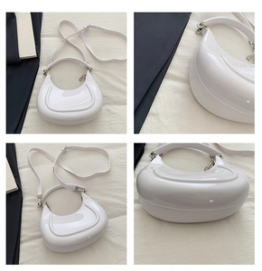 Detail shots of white crescent moon handbag showing glossy finish and adjustable strap