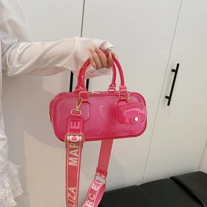 Translucent pink jelly crossbody bag set with wide fabric strap and mini pouch