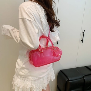 Pink translucent PVC Boston bag with Marc Eliza logo and a small coin purse pendant
