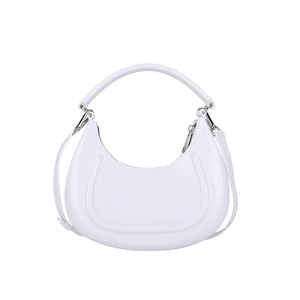White minimalist crescent moon handbag in glossy leather with adjustable shoulder strap