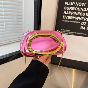 Pink mirrored acrylic evening clutch with gold circular handle and metal chain strap