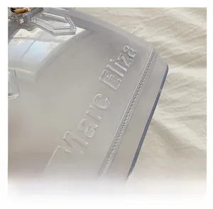 Detailed close-up of PVC jelly bag with Marc Eliza embossed logo and precision stitching