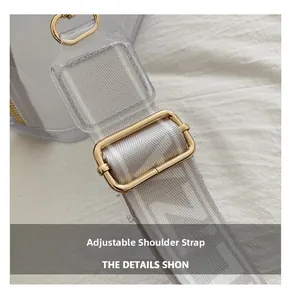 Detail of adjustable woven shoulder strap with gold metal buckle on transparent PVC bag