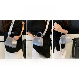 Three-way display of PVC jelly bag featuring wide printed strap and mini coin purse detail