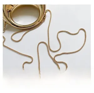 Detailed close-up of a polished gold metal chain strap for a Chinese style handbag