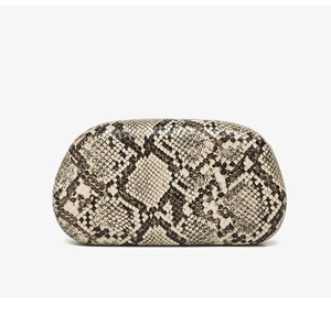 Detailed view of the luxury python snake skin texture on a structured bucket handbag