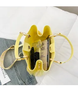 Top view of bright yellow patent leather tote bag interior showing large storage capacity