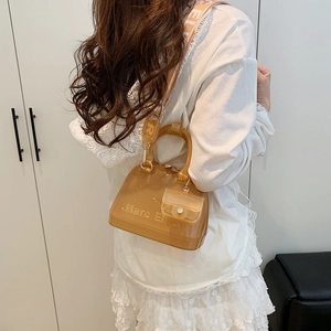 Fashionable semi-transparent yellow PVC jelly bag with a wide jacquard brand strap