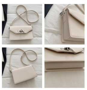 Detail view of cream crossbody bag with toothpick pattern and metallic turn-lock closure