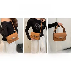 Brown textured leather Kelly bag featuring versatile hand-carry, shoulder, and crossbody straps