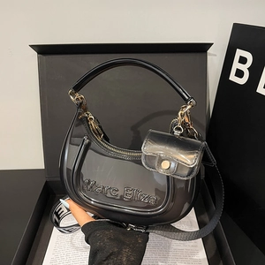 Chic black jelly crescent handbag with matching mini pouch and gold hardware accents