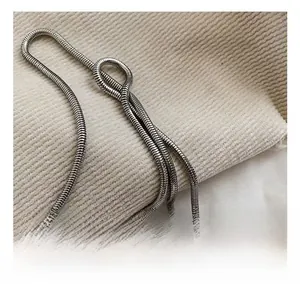 Detailed close-up of a premium silver snake chain strap with polished metallic finish