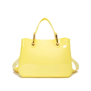 Chic yellow glossy PVC tote bag with cylindrical handles and branded wide shoulder strap