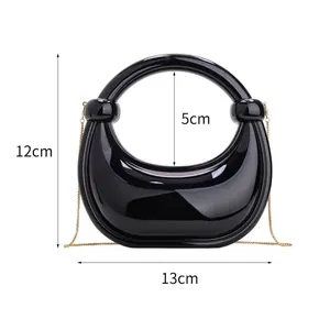 Mini black acrylic crescent handbag with gold chain strap, size 13cm width and 12cm height