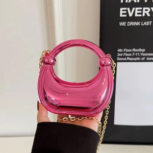 Chic hot pink laser acrylic crescent bag with circular handle and gold chain strap